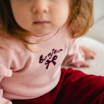 Fluffy Tails Bluzka niemowlęca prążkowana Eevi – różowa, z falbankami na ramionach