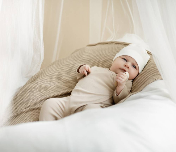 Lovely Day Pajac niemowlęcy wiązany Pinokio - beżowy