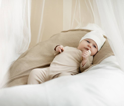 Lovely Day Pajac niemowlęcy wiązany Pinokio - beżowy